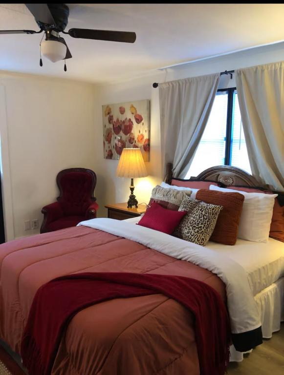a bedroom with a large bed and a window at Cozy private room in Princeton