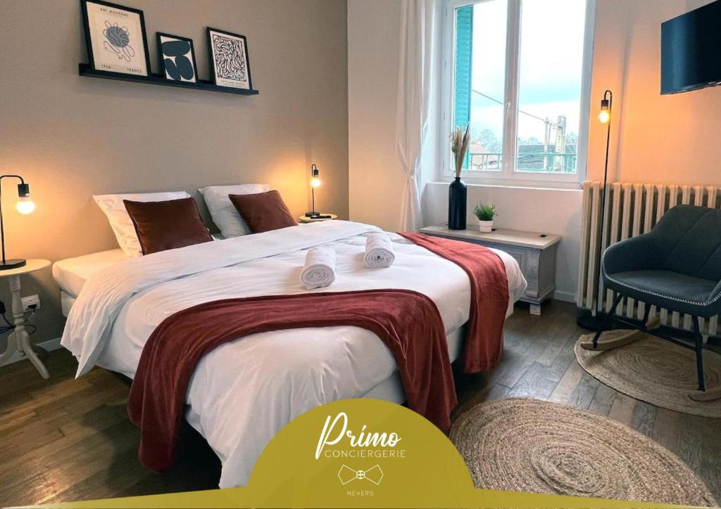 a bedroom with a large bed and a chair at Le Sorbier, Style Appart'Hôtel, vers la gare, by PRIMO C0NCIERGERIE in Nevers