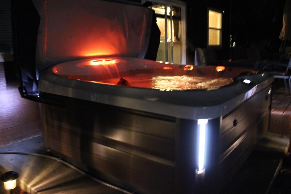 a jacuzzi tub in a room at night at Colorado Cottage W/Mountain View in Colorado Springs