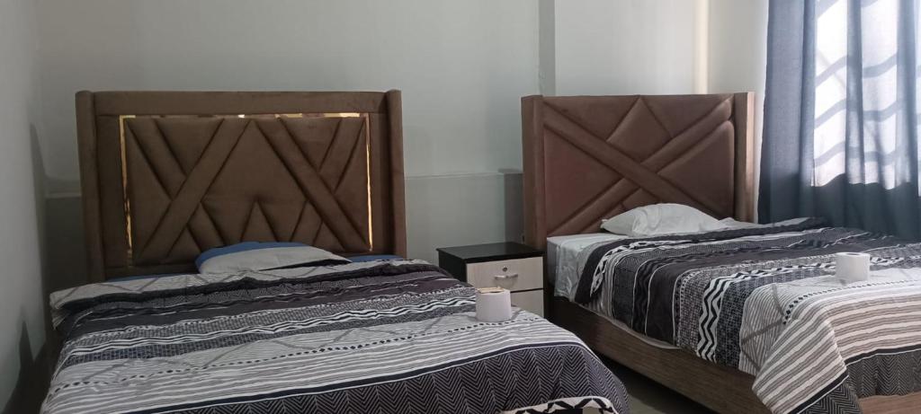 Ένα ή περισσότερα κρεβάτια σε δωμάτιο στο Hospedaje Paraíso