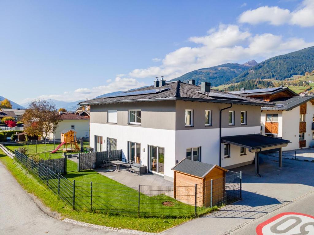 a house with a ping pong table and a playground at JooP in Niedernsill