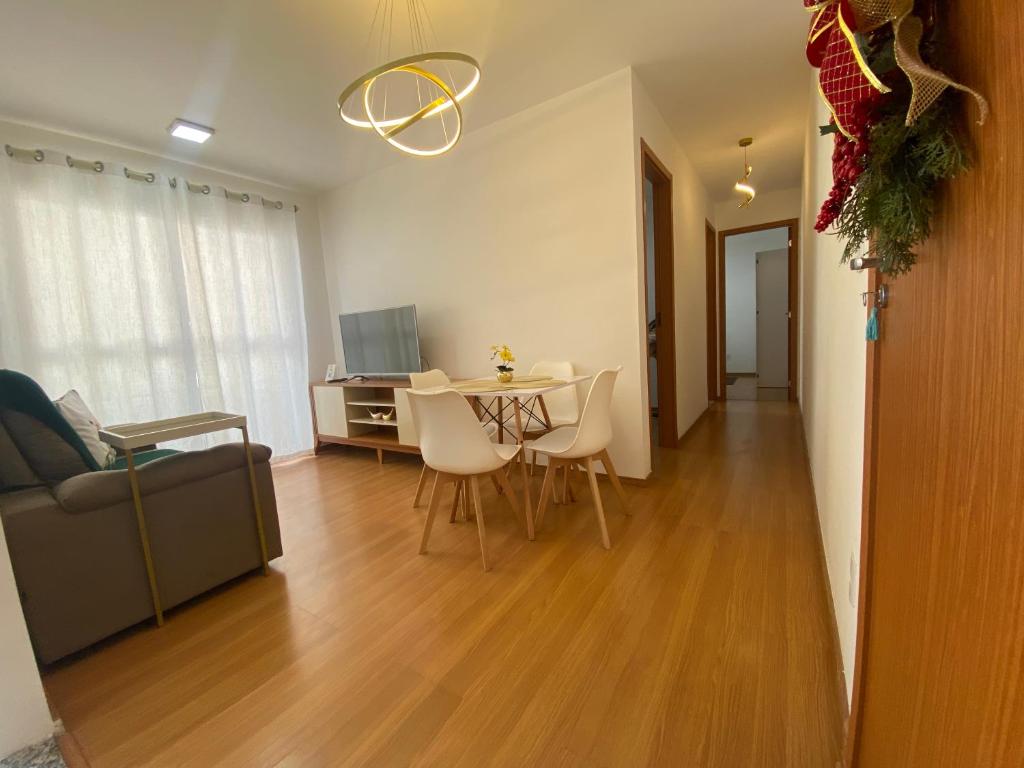 a living room with a table and a couch at AP Iilha de Aruba Prox a Avenida Litoranea in São Luís