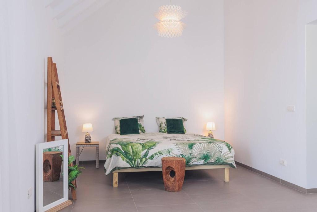 Postel nebo postele na pokoji v ubytování Villa Ora di Oro - by Mi Cuna Stays Collection