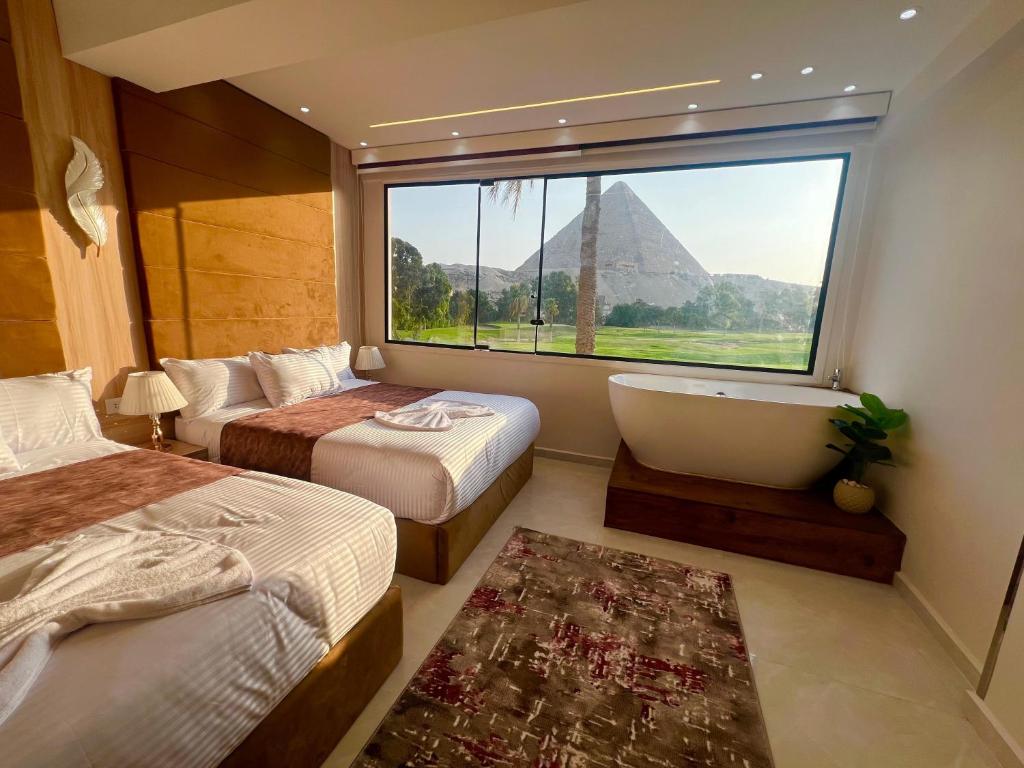 Ένα ή περισσότερα κρεβάτια σε δωμάτιο στο New Joia Pyramids Hotel