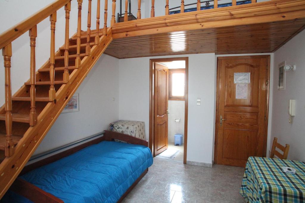 Postel nebo postele na pokoji v ubytování Afroditi Syros