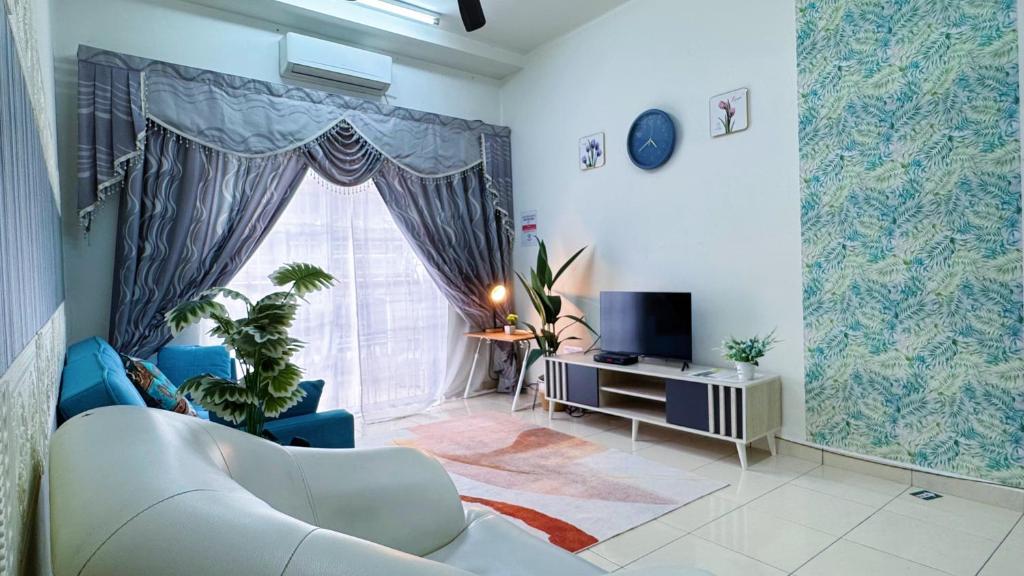 a living room with a couch and a window at Sri Ixora Kajang Fully Air Con Suite in Kajang