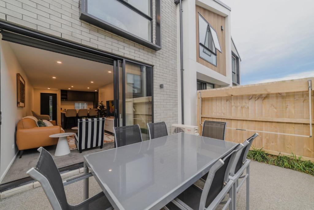 a white table and chairs on a patio at Modern Addington Escape Stylish 2br Townhouse in Addington