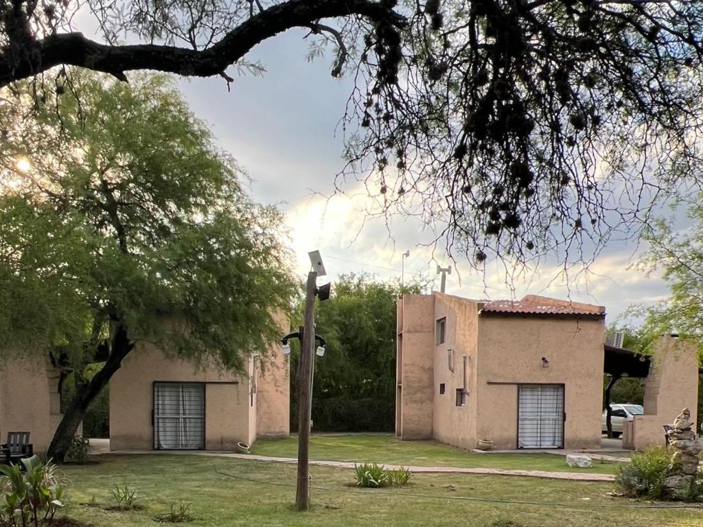 a house with a street light in front of it at Cabañas Refugio Lavanda in Villa de Las Rosas