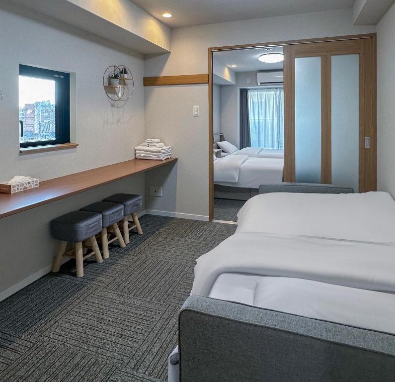 Ένα ή περισσότερα κρεβάτια σε δωμάτιο στο Dc桜の苑-難波南店