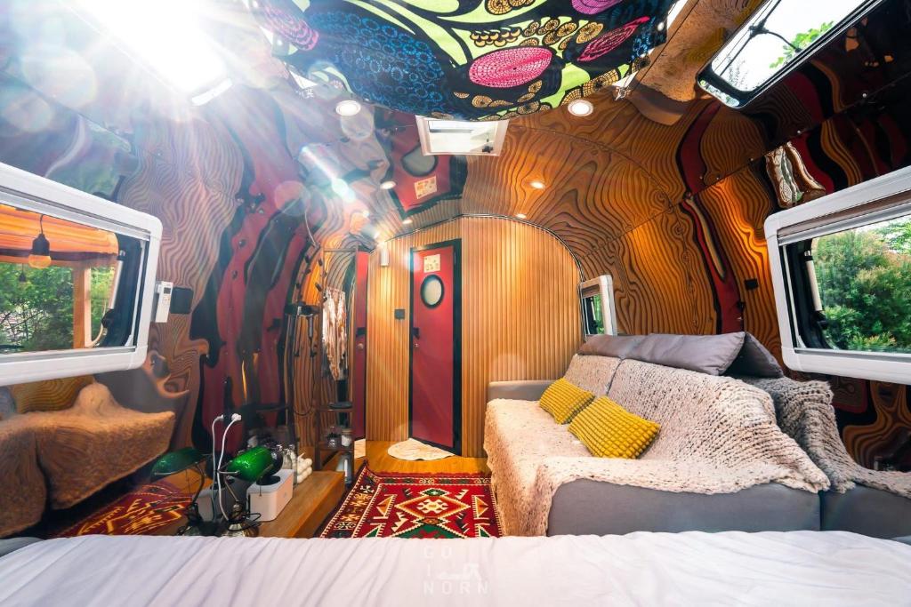 a room with a bed in a train car at Moyard Khaoyai in Ban Khanong Phra Klang (1)