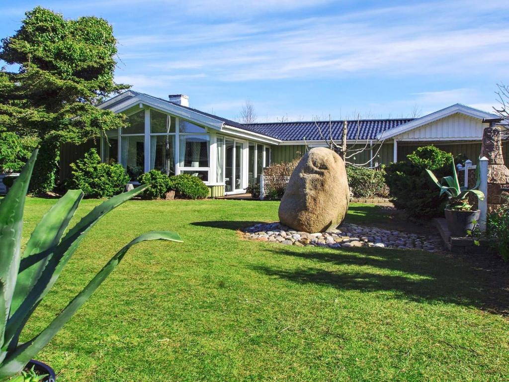 a large statue of a sheep in the yard of a house at Luxury Retreat in Bork Havn - By Traum Ferienwohnungen in Hemmet
