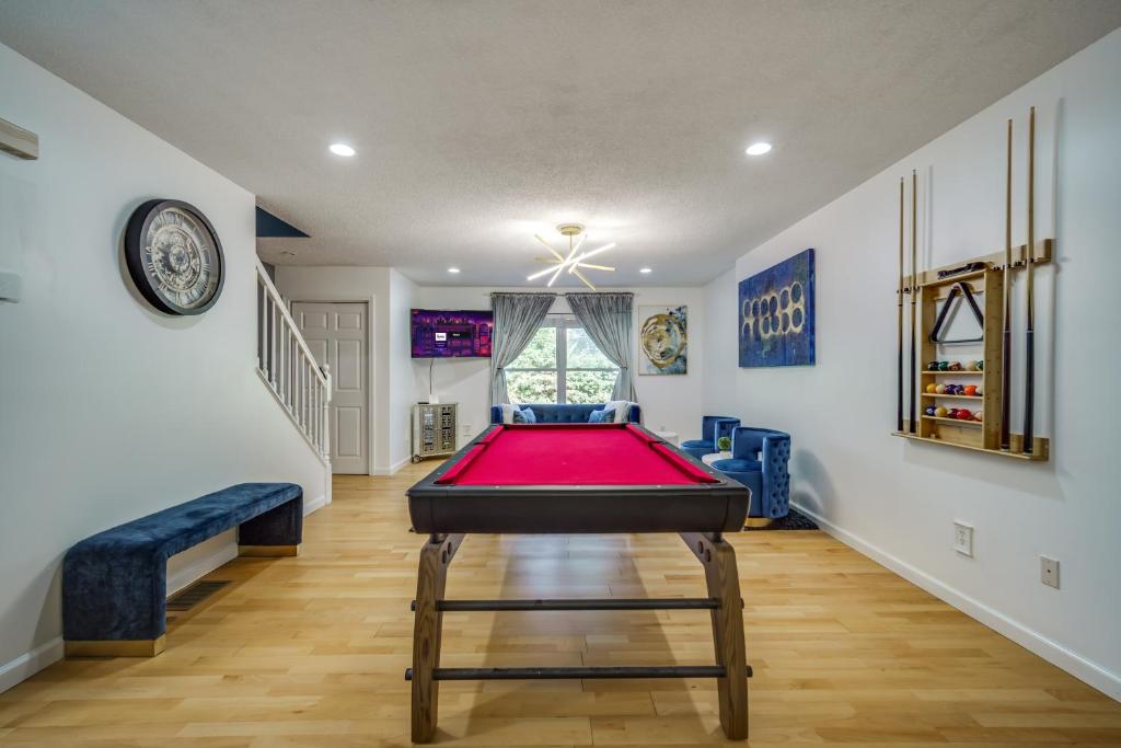 a living room with a pool table in it at King Bed with Pool Table in Chicopee