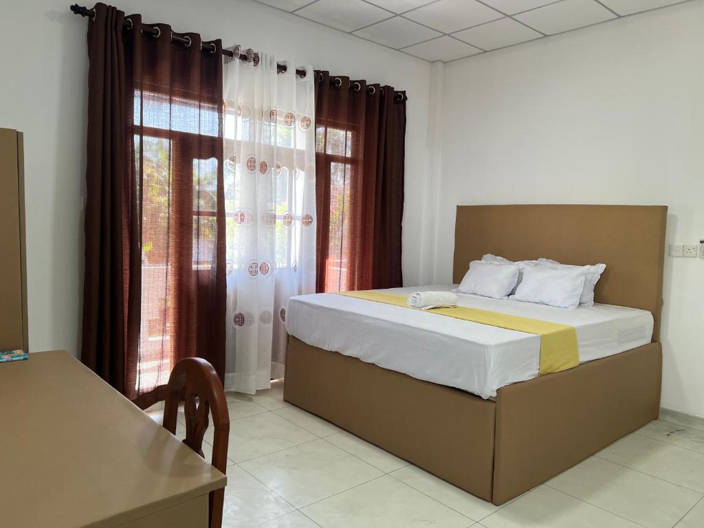 En eller flere senge i et værelse på Blossem Villa Mirissa