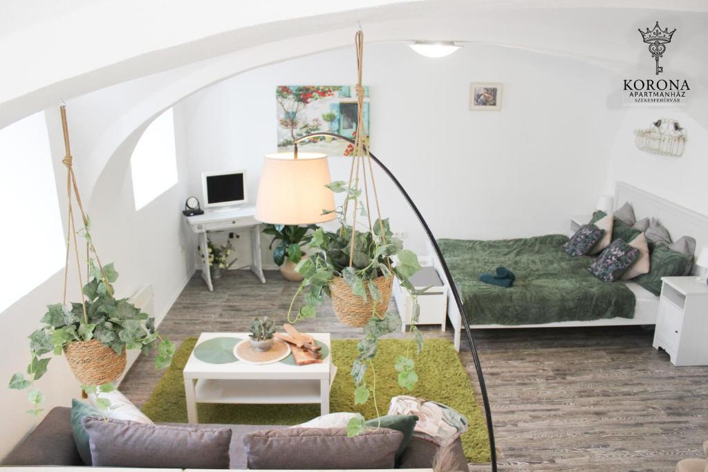 a living room with a couch and a table at Korona Apartman Székesfehérvár in Székesfehérvár