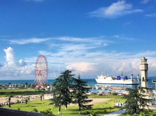 a ferris wheel and a ferris wheel with a ferris wheel at Mancho's Apartment 8 in Batumi