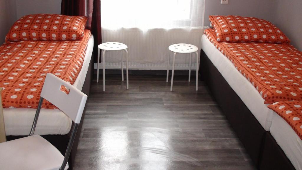 Posteľ alebo postele v izbe v ubytovaní Hostel Kamienna Centrum