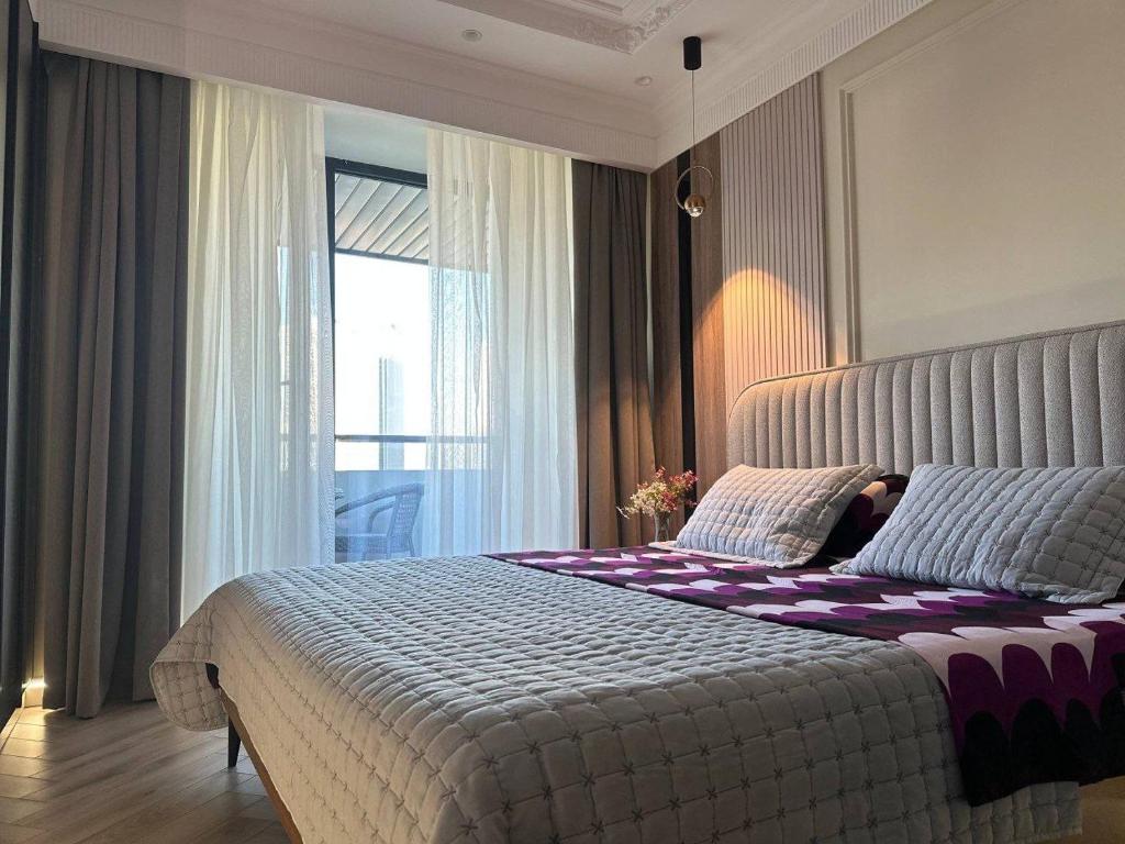 Postel nebo postele na pokoji v ubytování Апартаменты в элитном ЖК NRG U-TOWER