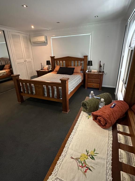a bedroom with a bed and stuffed animals on the floor at Everingham Views in Rockhampton