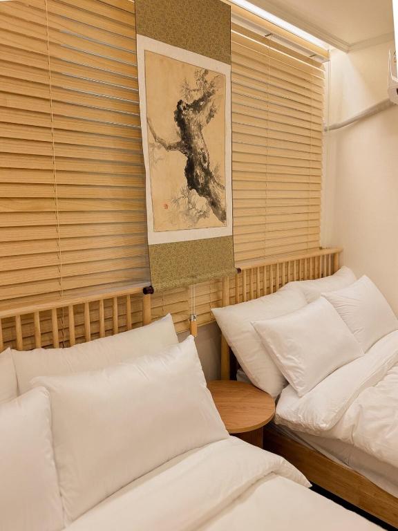 Ένα ή περισσότερα κρεβάτια σε δωμάτιο στο Open Special Price Mujeong Station 7 minutes Lotte World Seokchon Lake Garden Five Adjacent Two Rooms 4 people, up to 8 people