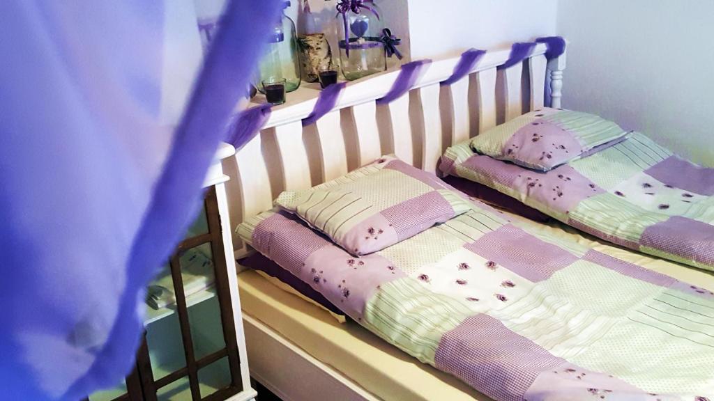 מיטה או מיטות בחדר ב-Kis Sziget Vendégház