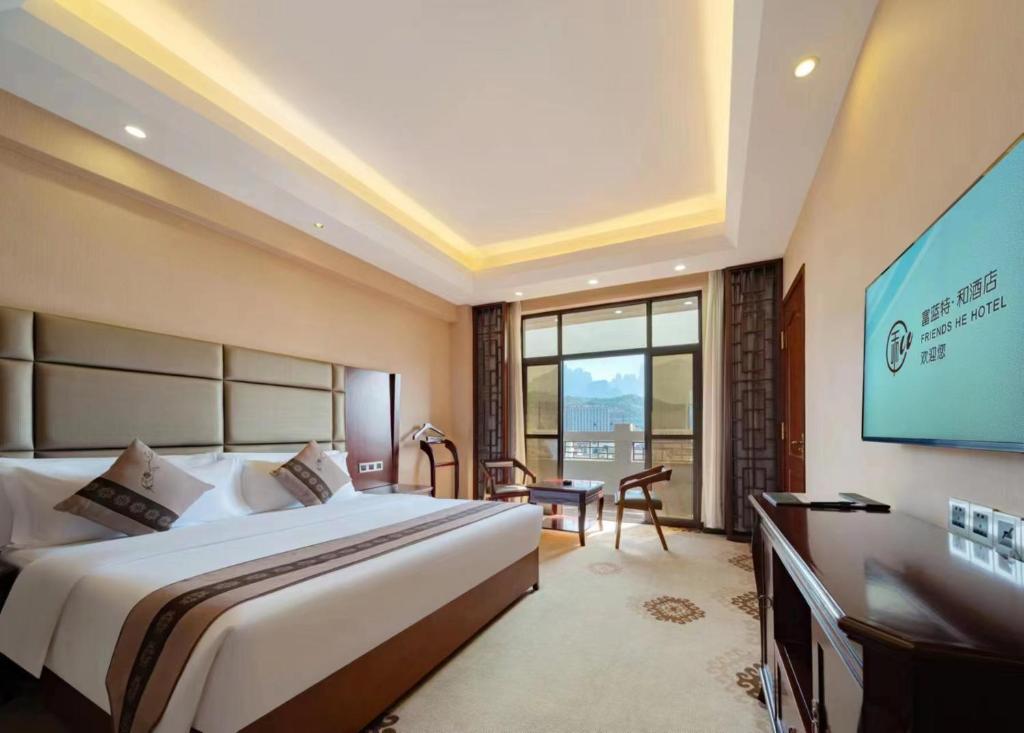 Ένα ή περισσότερα κρεβάτια σε δωμάτιο στο The Sky Gate Hotel