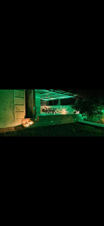 a night view of a building with a fire pit at Bungalow in Lonavala