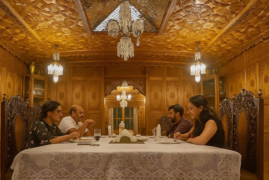 a group of people sitting around a table at halloween palace in Srinagar
