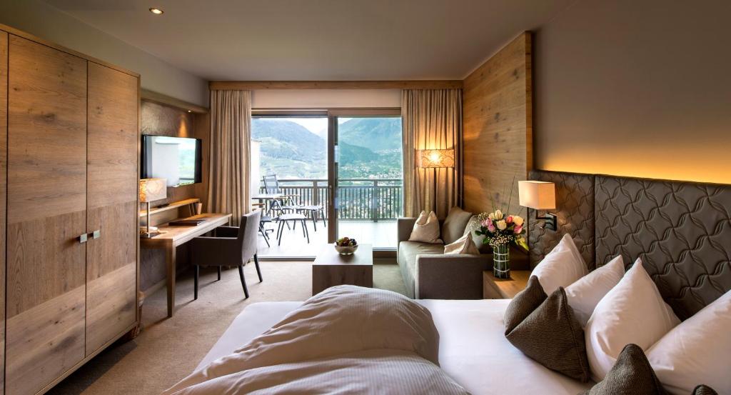 Postel nebo postele na pokoji v ubytování Hotel Sonnbichl