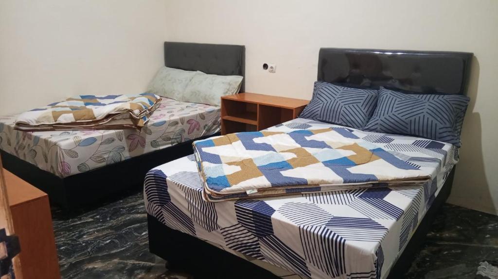 Postel nebo postele na pokoji v ubytování Homestay Safira Bromo