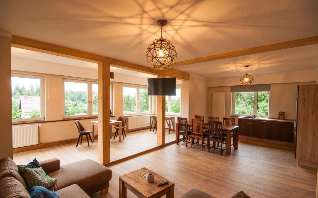 a living room with a couch and a table at Naturpur Ferienhaus in Thale