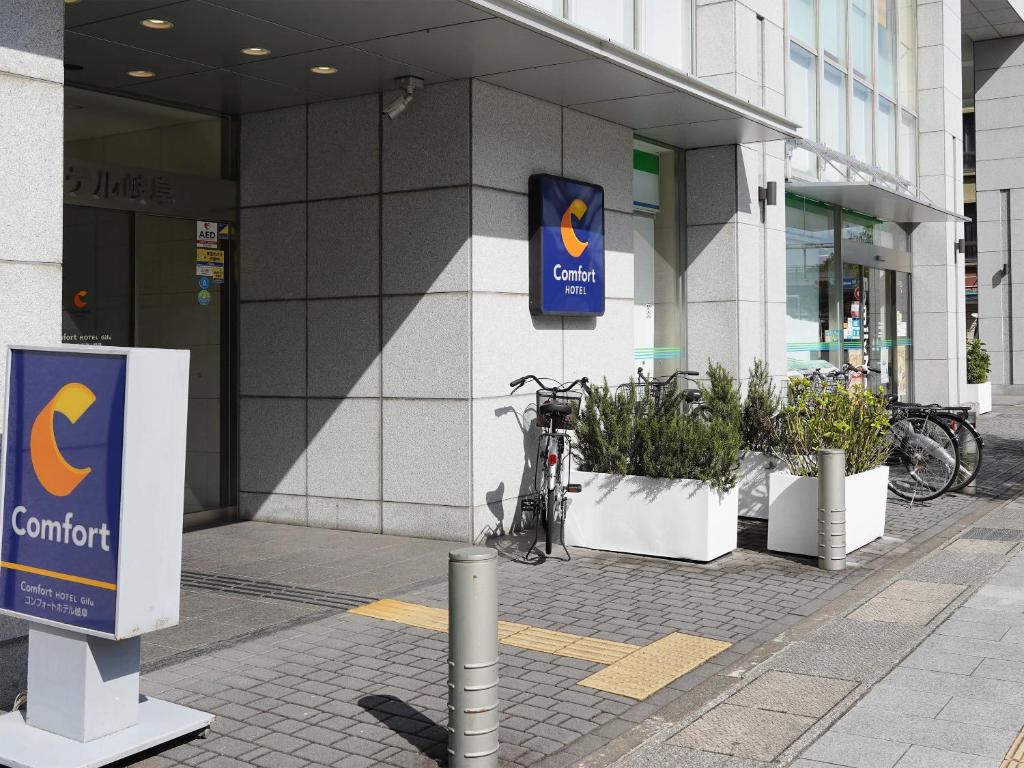 a bike parked in front of a building at Comfort Hotel Gifu in Gifu