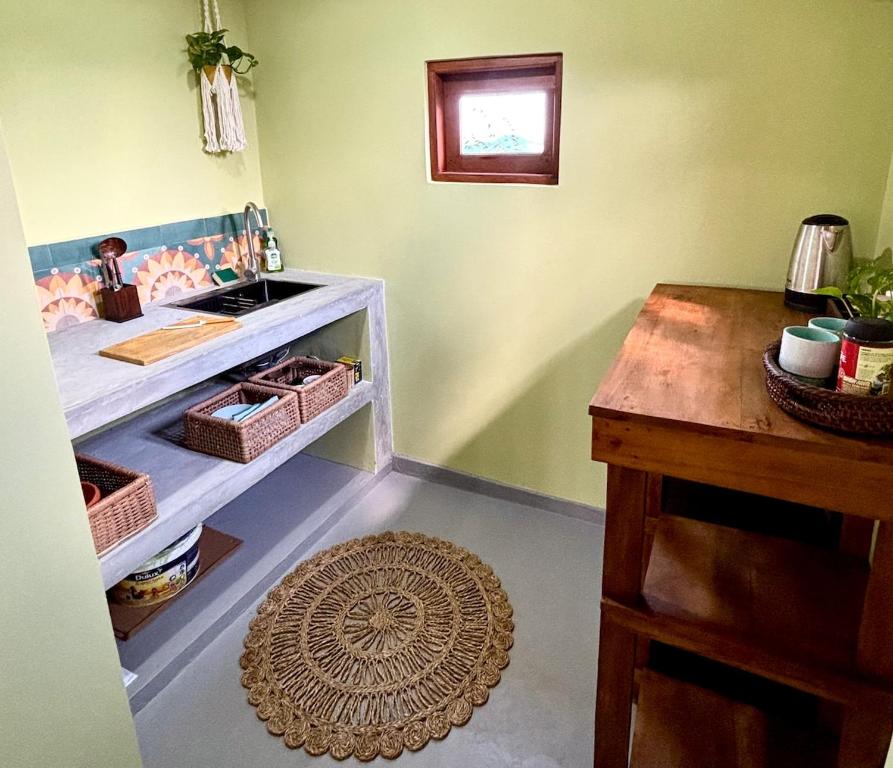 a room with a counter and a table and a rug at HAVEN-Your Private Mountain Sanctuary in Talatuoya