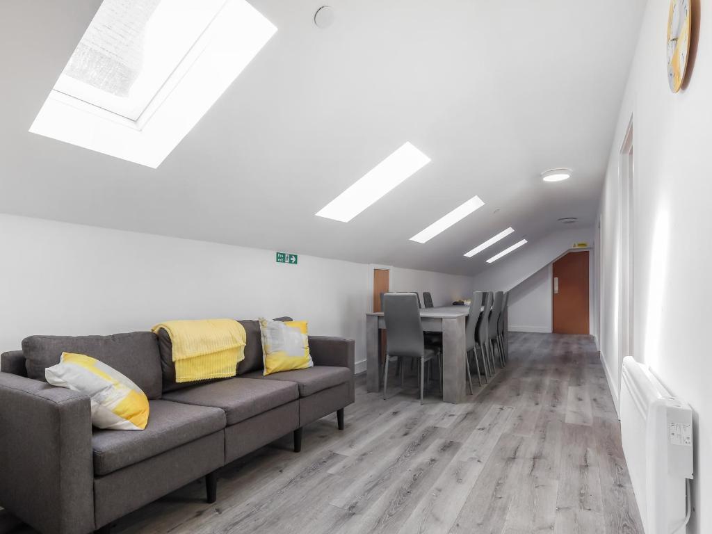 a living room with a couch and a table at Room 1 At The Cwtch in Chepstow
