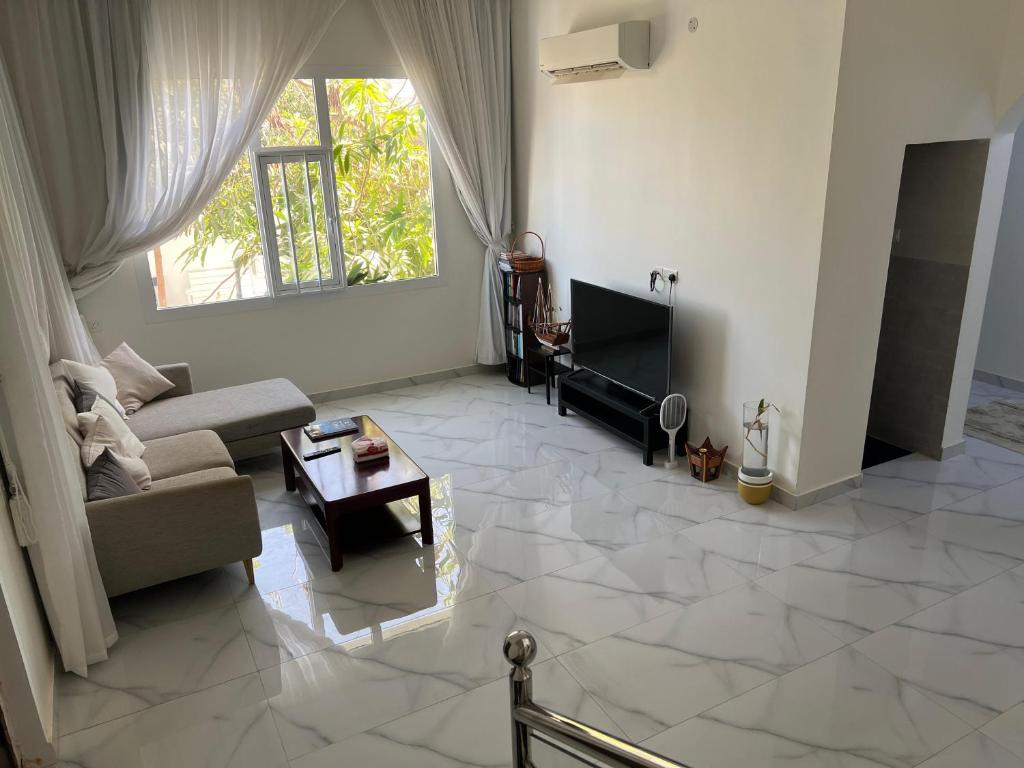 Posezení v ubytování Palm and wave