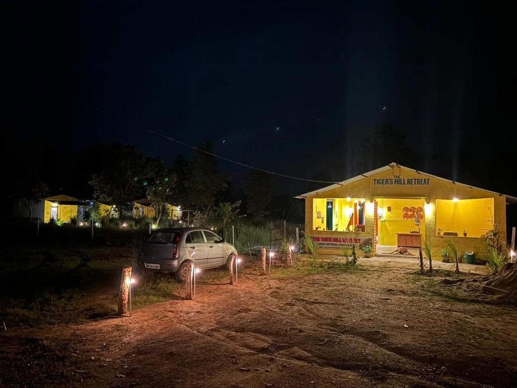 a car parked in front of a building at night at The Tiger's Hill Retreat in Lagma