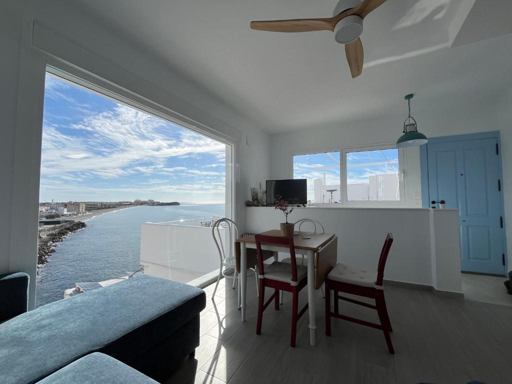 a living room with a view of the ocean at Villa Balcony of La Caleta in Salobreña