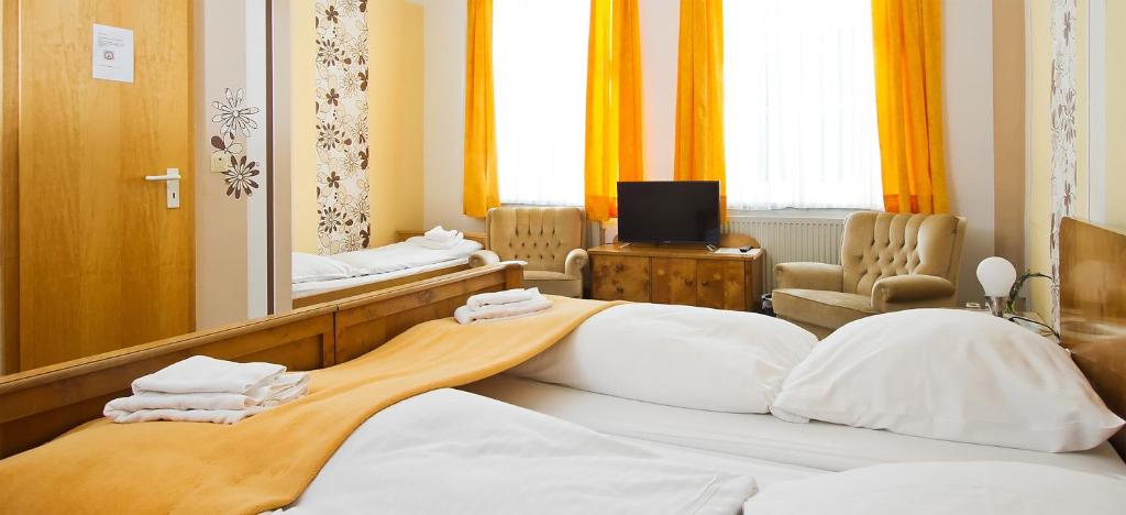Postel nebo postele na pokoji v ubytování Hotel Neun 3/4