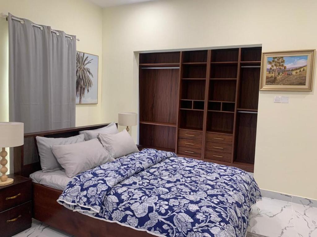 a bedroom with a bed and a book shelf at BethelAirbnb 