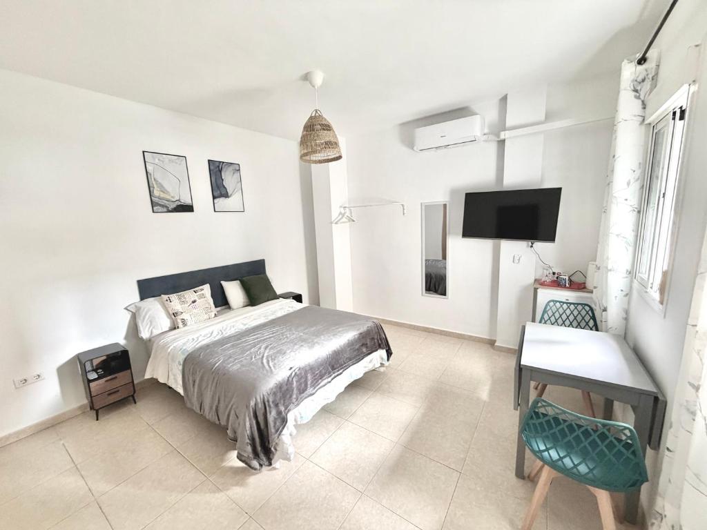 Ένα ή περισσότερα κρεβάτια σε δωμάτιο στο Luna Ensuites Centro