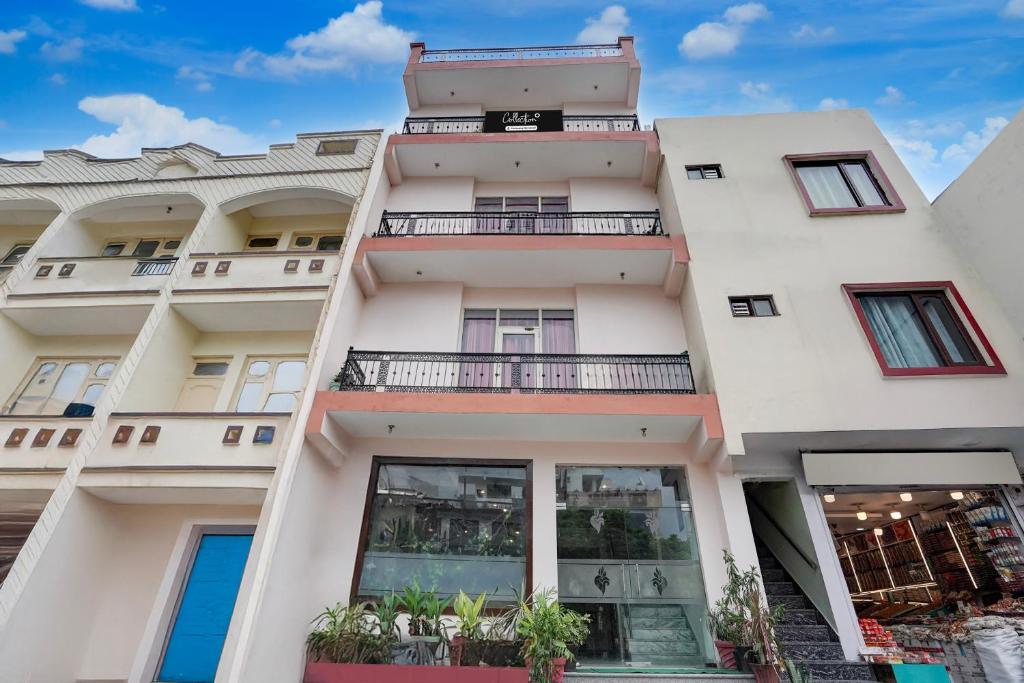 a building with windows and balconies on it at Super Collection O Vaishno Devi Temple Formerly Hotel The Leaf in Katra