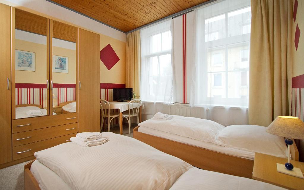Postel nebo postele na pokoji v ubytování Hotel Neun 3/4