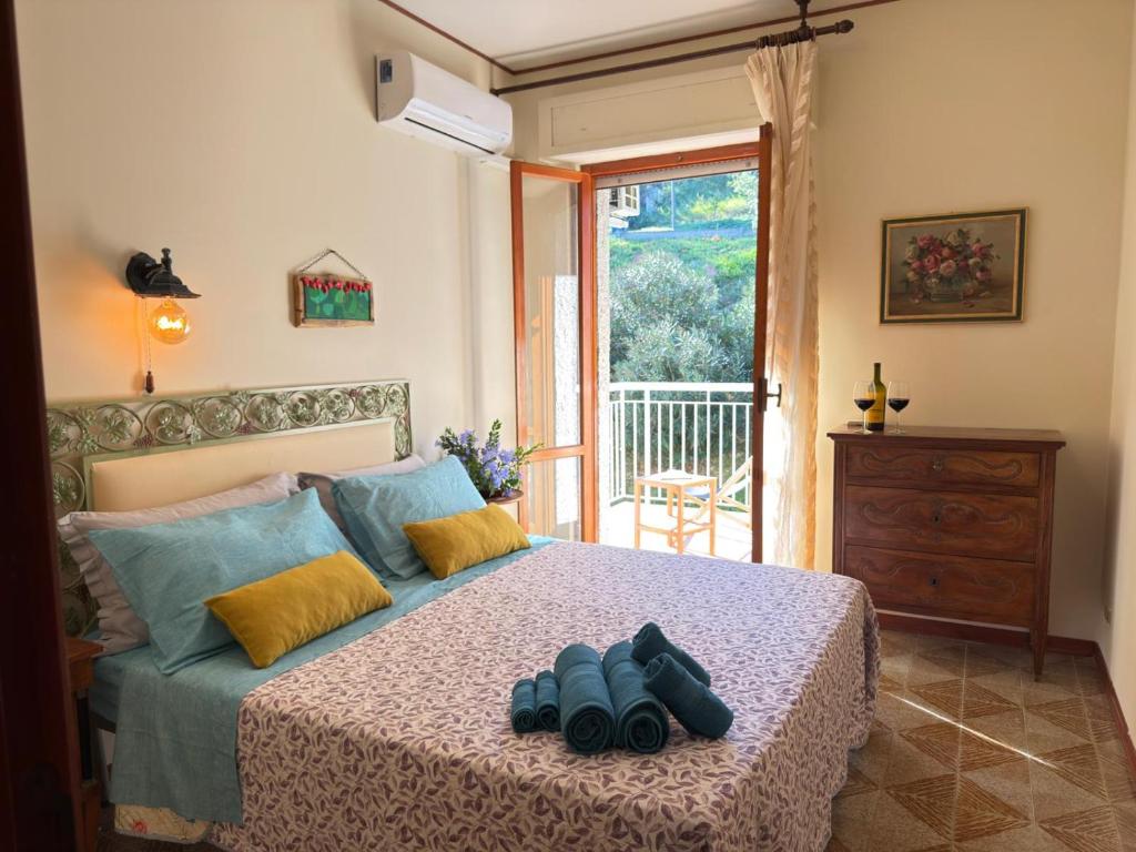 a bedroom with a bed with two shoes on it at Terrazza vista mare-Parcheggio gratuito -3Min A14 -Mastrangelo Beach in Grottammare