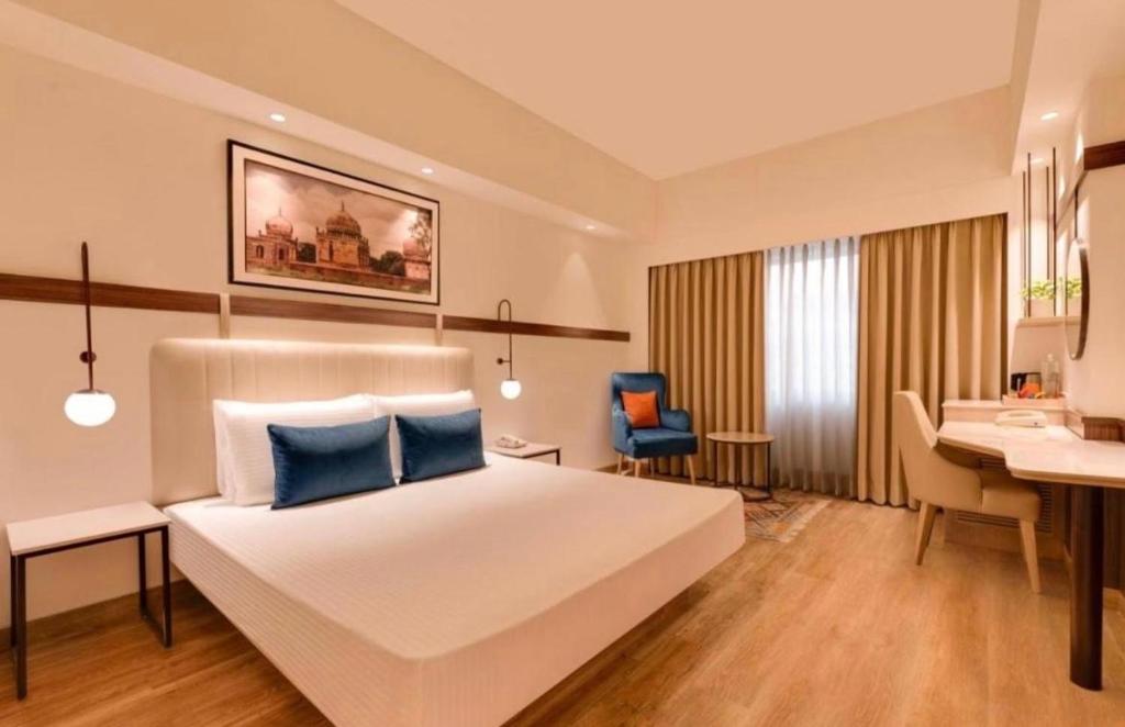 Ένα ή περισσότερα κρεβάτια σε δωμάτιο στο Hotel Rosewood-Near Delhi Airport & Free Airport Drop