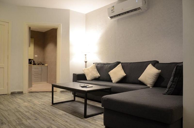 a living room with a couch and a coffee table at شقة 9 in Al-Safa