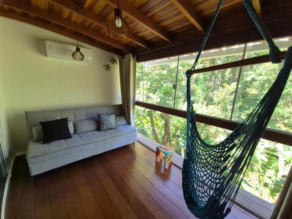 Ένα ή περισσότερα κρεβάτια σε δωμάτιο στο Conforto Maresias