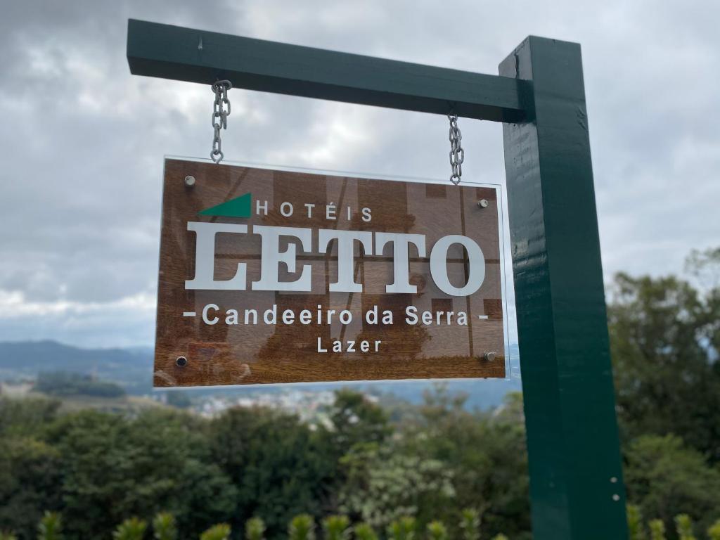 a sign for a hotel enriquecanocano da serbia later at Letto Hotel Candeeiro da Serra in Salvador do Sul