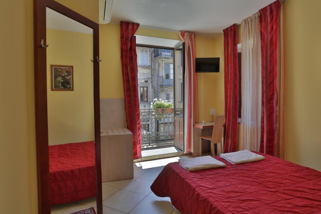Postel nebo postele na pokoji v ubytování Hotel Conte Ruggero