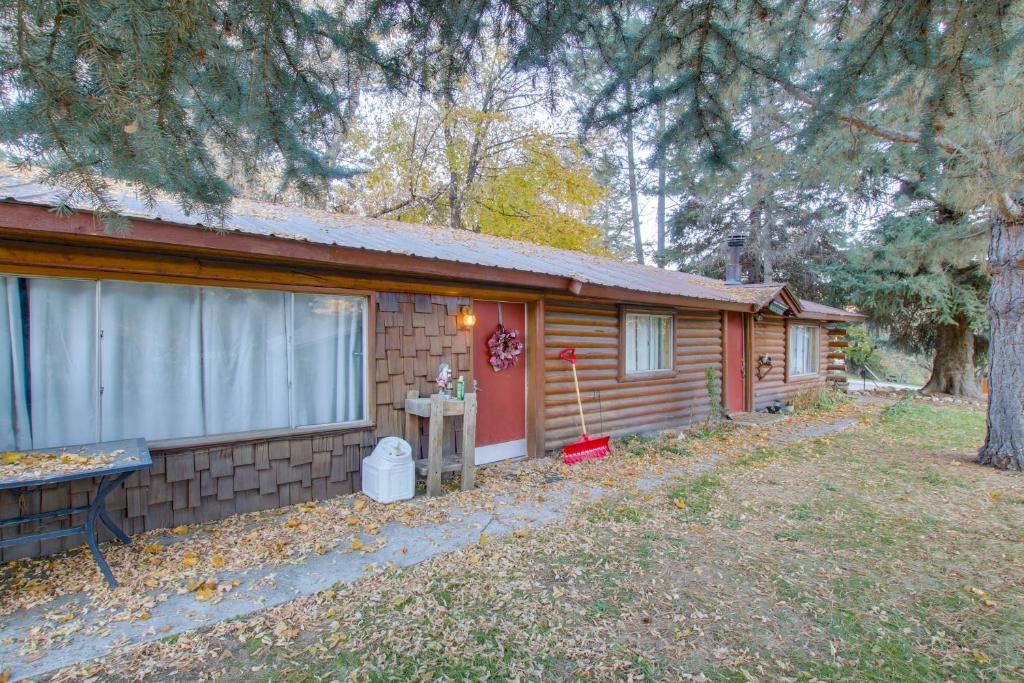 a log cabin with a yard in front of it at Walk to Lava Hot Springs Pools from Cozy Cabin! in Lava Hot Springs