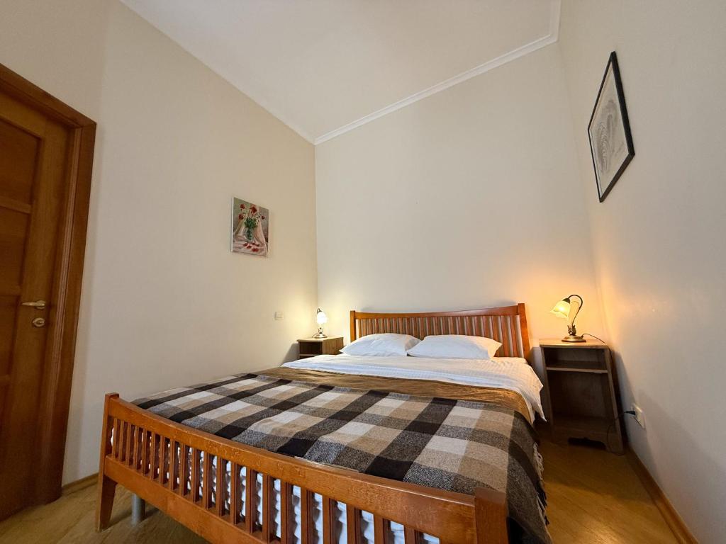 Postel nebo postele na pokoji v ubytování Kyiv Gallery Apartment