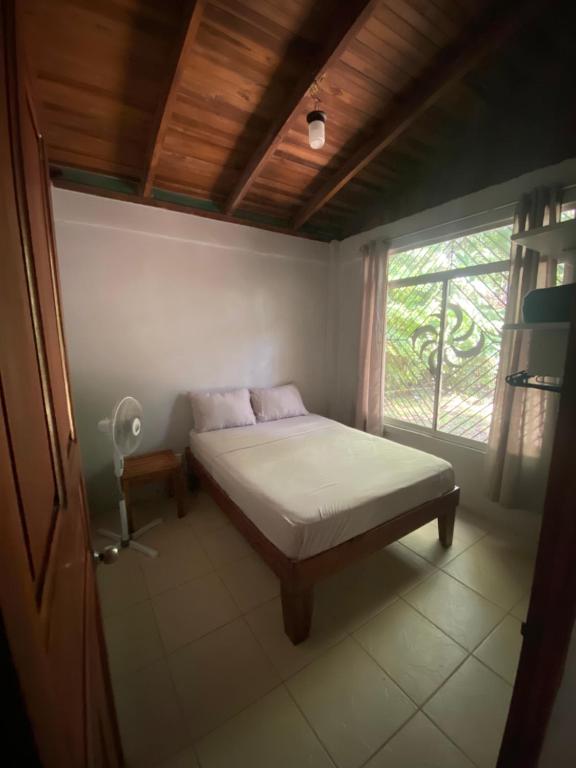 Ένα ή περισσότερα κρεβάτια σε δωμάτιο στο El Templo